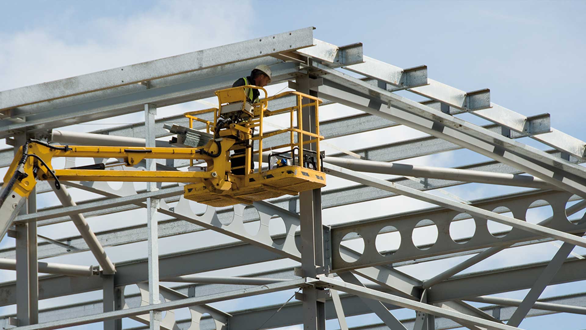 Worker installing secondary steel structure